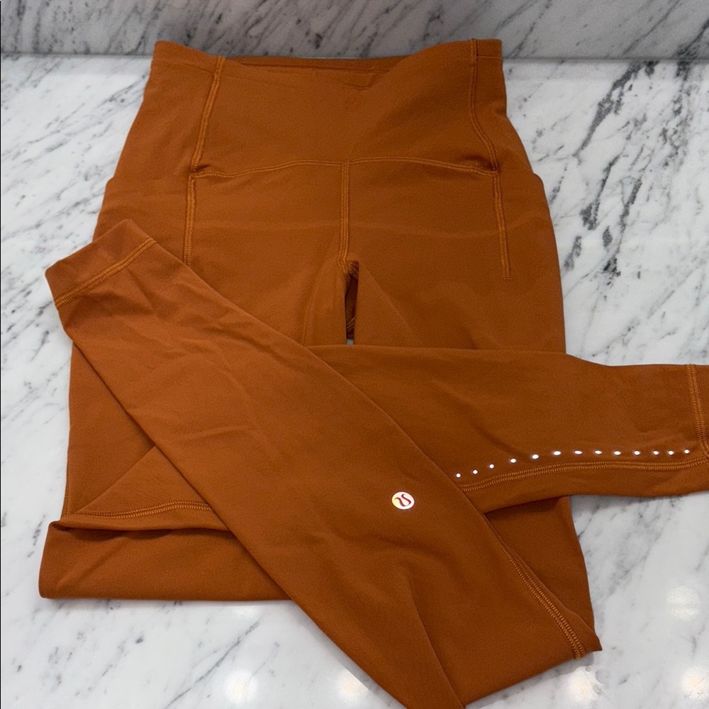 Lululemon High-Waisted Leggings. 27” inseam side pockets reflection dots on calf